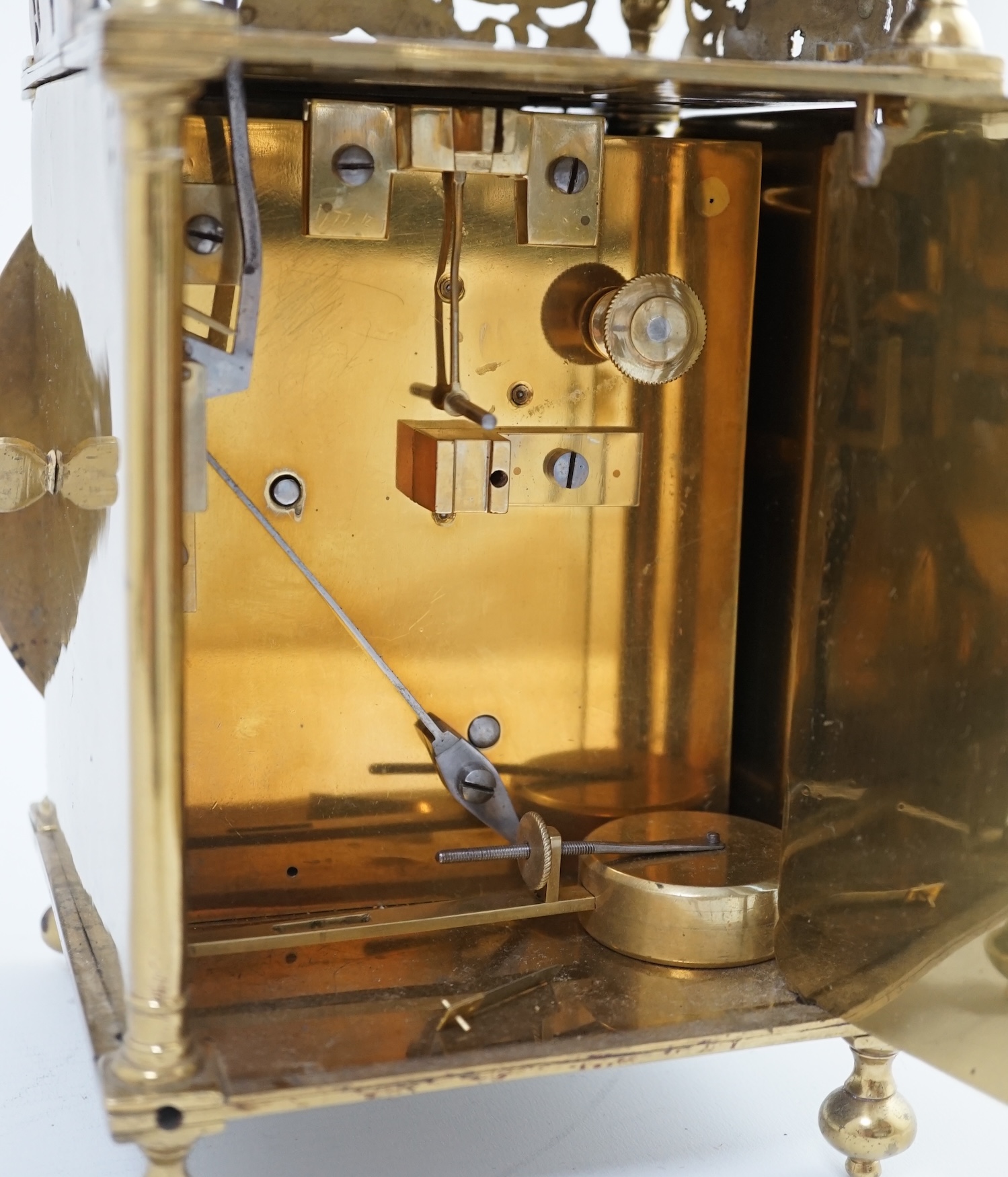 Manner of Richard Rayment of Bury. A Victorian 17th century style lantern clock, in traditional brass case with silvered Roman dial and eight day single fusee movement striking on a bell, 17cm wide, 14.5cm deep, 38cm hig